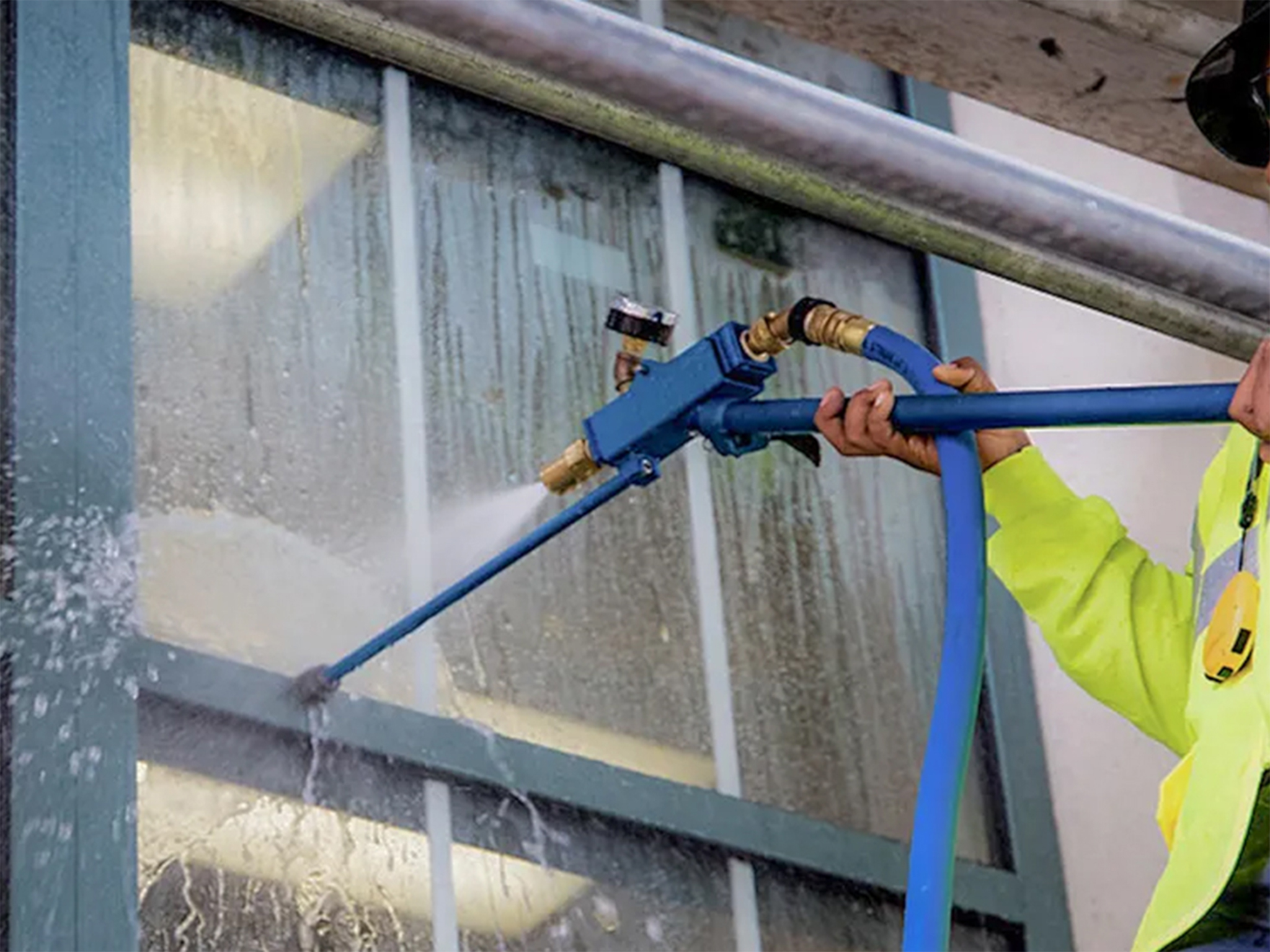Facade water spray testing - a man is spraying directly into the window